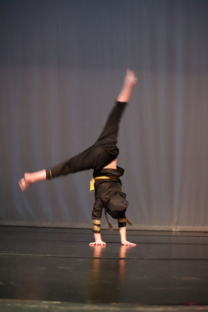 young dancer doing a handstand